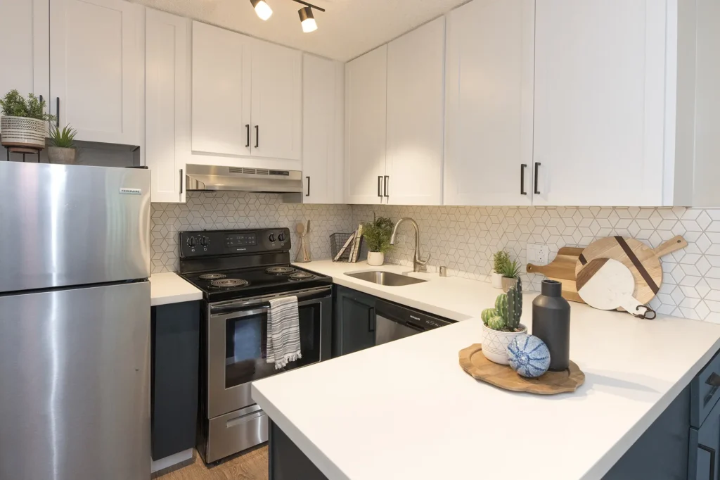 Kitchen with stainless steel appliances and tile back splash
