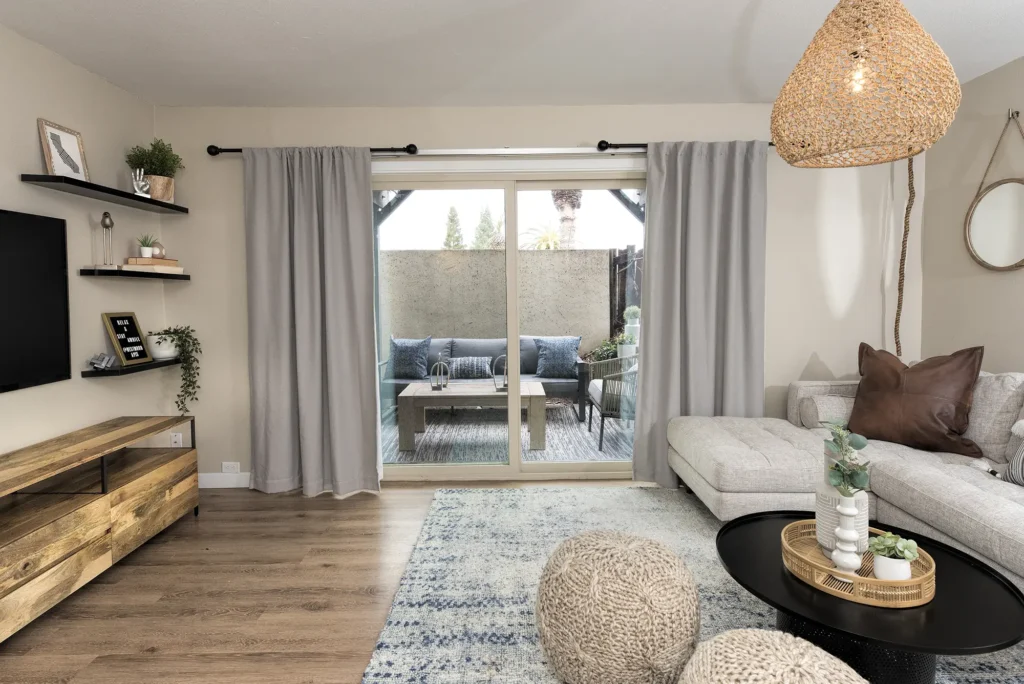 Living room with glass doors leading to a private patio